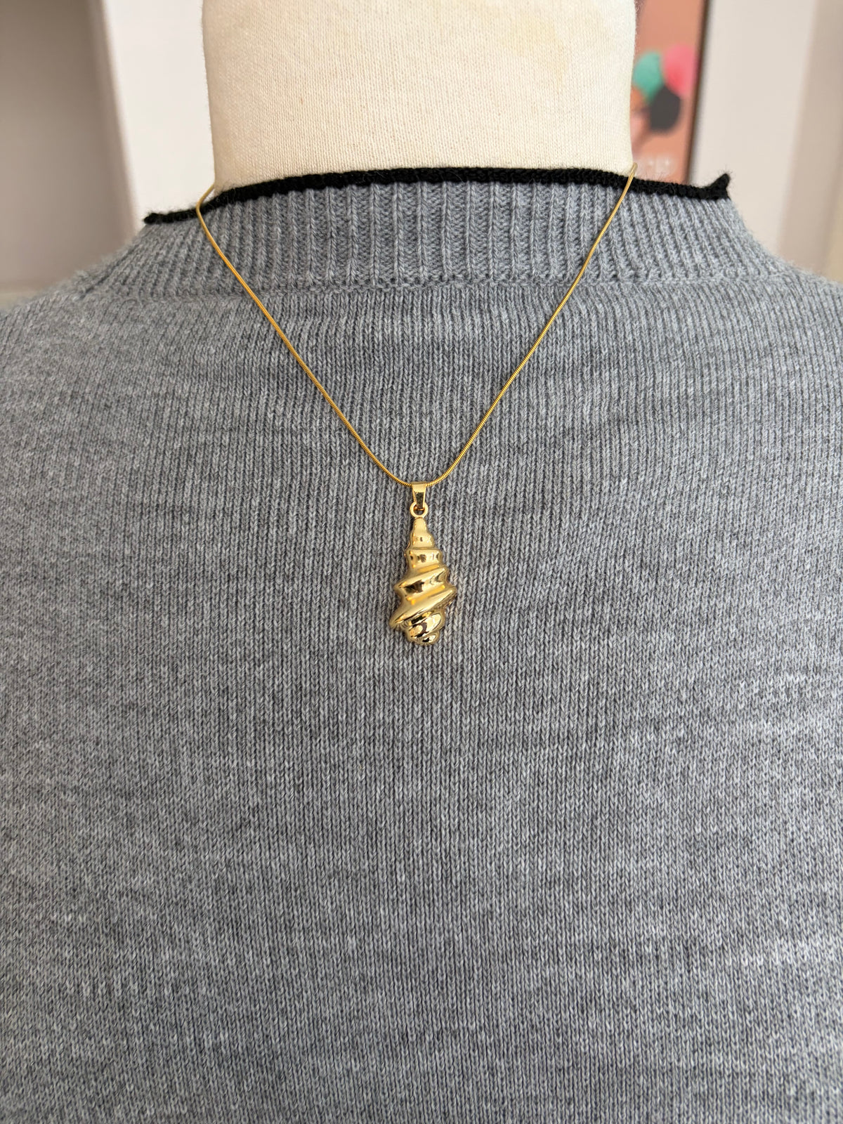 Collier coquillage doré